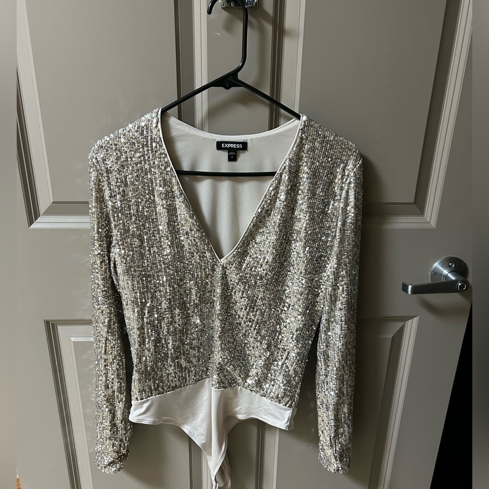 Champagne colored sequence bodysuit.
